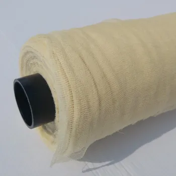 Utěrka Lepivá utěrka v roli ze 100% nebělené bavlny, kterou je možné použít jako závěsnou bariéru k zachycení polétavých částic, jako je prach a laky.