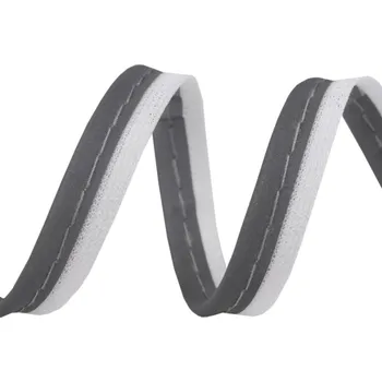 Reflexní pružný výpustek, paspulka, lemovka paspule