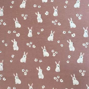 Bavlněný úplet s potiskem zajíc na starorůžové š. 140 cm EU