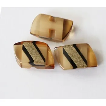 Knoflík Knoflík béžový/černý 127/44 - Hnědá, 23x10 mm