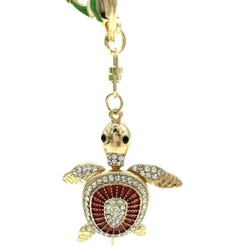 Klíčenka Kovová zlatá želva s červeným kruhem na krunýři
