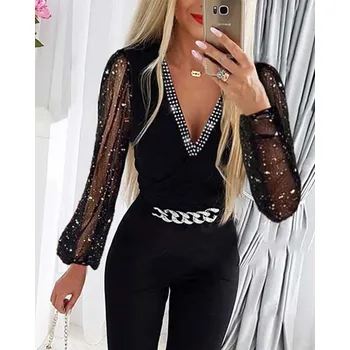 Dámské kalhoty Elegantní overal s hlubokým výstřihem do "V" se stříbrným lemováním Velikost: XL