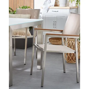 Sada 4 zahradních jídelních židlí béžové textilní sedadlo stříbrné nohy z nerezové ocele odolné Beliani