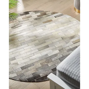 Koberec Kulatý koberec hnědý a béžový hovězí kůže ø 140 cm patchworkový v rustikálním stylu Beliani