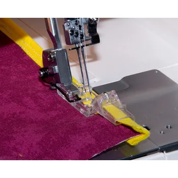 Příslušenství k šicímu stroji Merrylock - patka se zakladačem lemovky