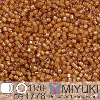 Korálek Korálky Miyuki Delica 11/0. Barva White Lined Topaz AB DB1778. Balení 5g.