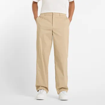 Pánské kalhoty Pánské kalhoty New Balance MP43560SOT – béžové