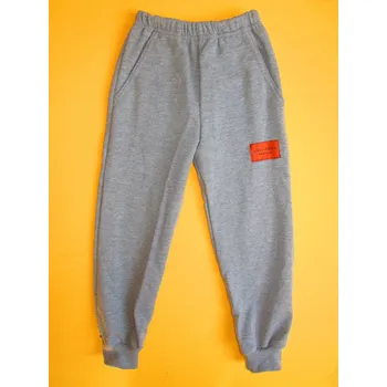 Arex, ČR Tepláky s manžetou jednobarevné s nášivkou 1 Barva: šedá, Velikost: 104