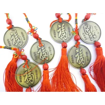 Čínská mince pro štěstí se znaky štěstí