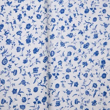 Tegatex Folklorní látka metráž - drobné modré kvítky na bílé