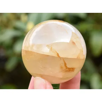 Přírodní kámen Křišťál s limonitem hladká koule 166g