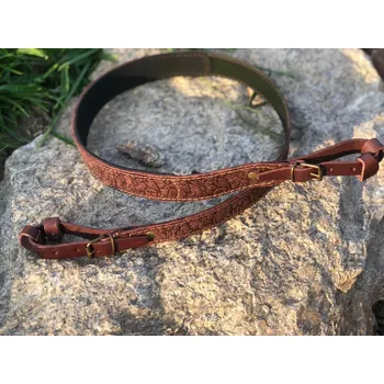 Příslušenství pro sportovní střelbu FORESTER - kožený řemen na zbraň zdobený protěž