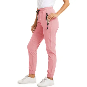 Dámské kalhoty Dámské elastické rychleschnoucí sportovní kalhoty Barva: Růžová, Velikost: L