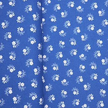Tegatex Folklorní látka metráž -bílé květy na modrém
