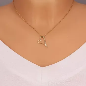 Přívěsek Přívěsek ve žlutém zlatě 585 - prodloužené srdce se zirkonky na nožičce