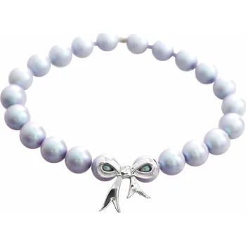 Náramek JSB bijoux s.r.o. Náramek z navlékaných modrých perel Swarovski s ocelovým přívěskem mašle