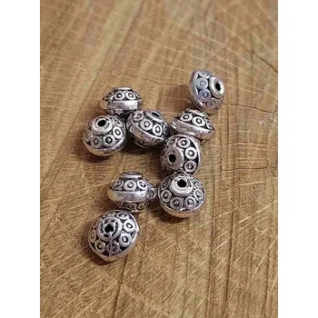 Korálek Kovový korálek disk ornament 7x9 mm barva platina s patinou