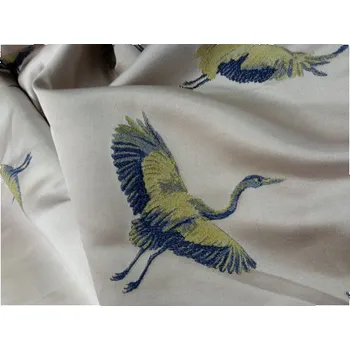 Dekorační a čalounická látka, barva pudrová s výšivkami volavek, metráž II. JAKOST