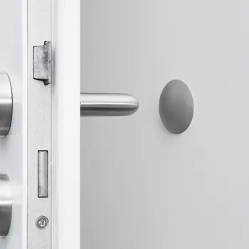 Dveřní kování Interex design Samolepicí dveřní zarážka INTRO / šedá 40 mm