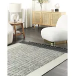 Koberec bílá a černá vlna a bavlna 140 x 200 cm ručně tkaný s dekorativními třásněmi Beliani