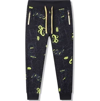 Dětská móda Chlapecké tepláky - KUGO FT6026, černošedá / hořčicově žluté zipy Barva: Černá, Velikost: 134