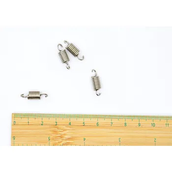 Příslušenství k šicímu stroji Pružina držáku vaček