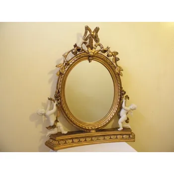 Zrcadlo ZRCADLO VE ZLACENÉM FIGURÁLNÍM RÁMU