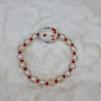 Náramek Retro náramek v bílo - oranžové barvě Louw