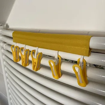 Věšák Věšák s kolíčky na žebřinový radiátor