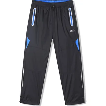 Chlapecké kalhoty Chlapecké šusťákové kalhoty - KUGO SK7752, černá / modré zipy Barva: Černá, Velikost: 146