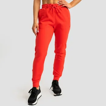 GymBeam Dámské tepláky Limitless Hot Red XXL červená