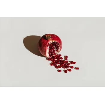Plakát Plakát, Obraz - ut pomegranate on a white background., Tanja Ivanova