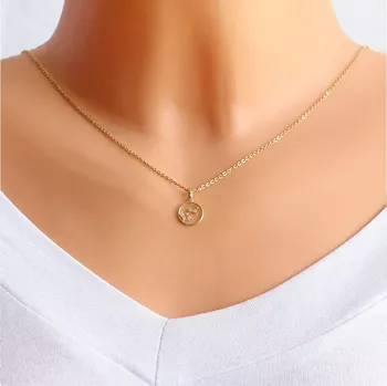 Přívěsek Kulatý přívěsek 14K žluté zlato, symbol souhvězdí Lev, čiré zirkony