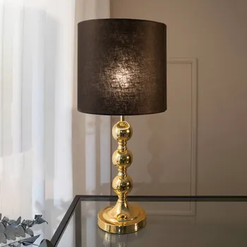 Lampička Markslöjd Stolní lampa Octo s látkovým stínidlem mosaz/černá - kabel 200 cm mosaz, černý 1 x 40 W - Doprava zdarma