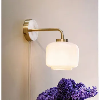 Lampička Dyberg Larsen, nástěnné svítidlo Arp, mosazná barva, šířka 15 cm - Délka zástrčkového kabelu 160 cm mosaz, bílá 1 x 20 W LED - Doprava zdarma