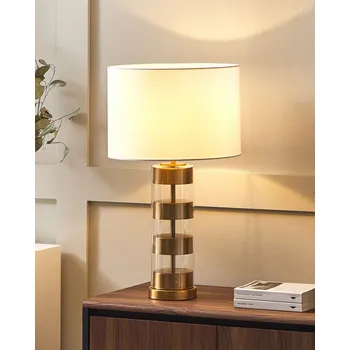 Stolní lampa zlatá/průhledná skleněná základna bílé látkové stínidlo ve tvaru bubnu Beliani