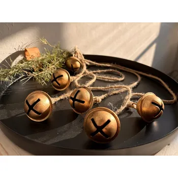 Obraz Závěs s malými zlatými rolničkami