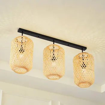 Stropní svítidlo Lucande Jorick, 3 světla, délka 104,5 cm, bambus - Stropní držák - délka 90 cm, šířka 5 cm, výška 2,5 cm; stínidla - Ø 24,5 cm, výška 40 cm světlé dřevo, černá 3 x 15 W LED - Doprava zdarma