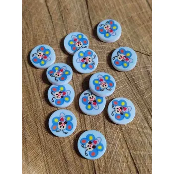Knoflík Knoflík dětský dvoudírkový vzor motýl barva modrá