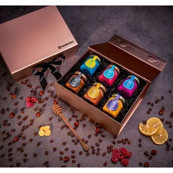 Dárkový potravinový koš Giftboxeo pro ženu - Ochucené medy