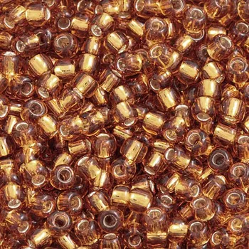 Korálek TOHO Co., Ltd. TOHO Round 11/0 Silver Lined Topaz