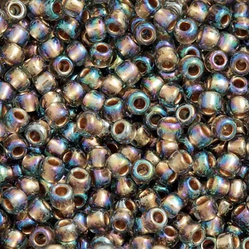 Korálek TOHO Co., Ltd. TOHO Round 11/0 Gold Lined Rainbow Black Diamond