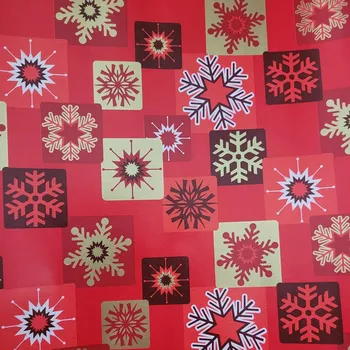 Obraz Červený balicí papír na dárky 70cm x 2m