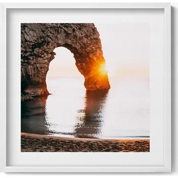 Obraz Závěsný obraz rámeček bílé barvy – Pobřežní skály, pláž a slunce 50x50 cm