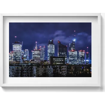 Obraz Nástěnný obraz v bílém rámu do obýváku, kuchyně - Budovy města v noci 70x50 cm