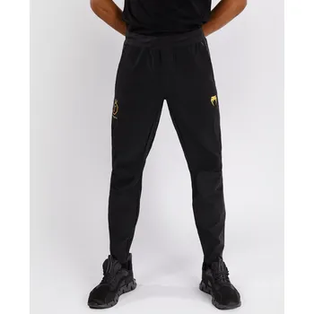 Pánské oblečení Pánské tepláky Venum x Ilia Topuria Unmatched - Black/Gold Velikost: XL