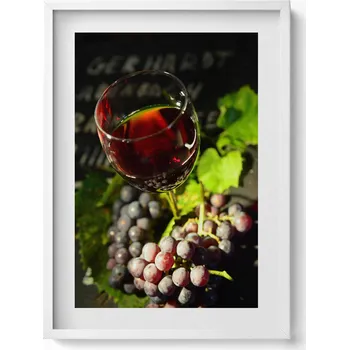 Obraz Nástěnný obraz v bílém rámu Sklenička červeného vína a hroznové víno 50x70 cm