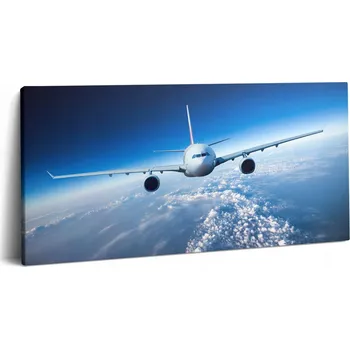 Obraz Fotoobraz na plátně Canvas do předsíně Klasické letadlo nad oblaky