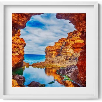 Obraz Dekorativní nástěnný obraz v rámu do obýváku Výhled zpod skal na moře 50x50 cm
