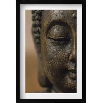 Obraz Elegantní obraz do obýváku v černém rámu Tvář sošky Buddhy Zen 40x60 cm